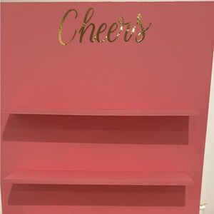 Pink Wall Shelf with Gold 'Cheers' Sign